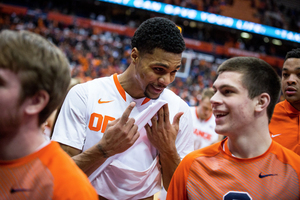 Syracuse walk-on guard Mike Sutton, right, played 12 minutes over seven games this season. 