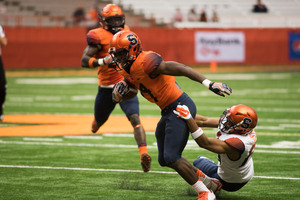 The Syracuse football team offered a glimpse, though short, of what the 2017 unit will look like. Here, Dontae Strickland works to break free of a tackle. 